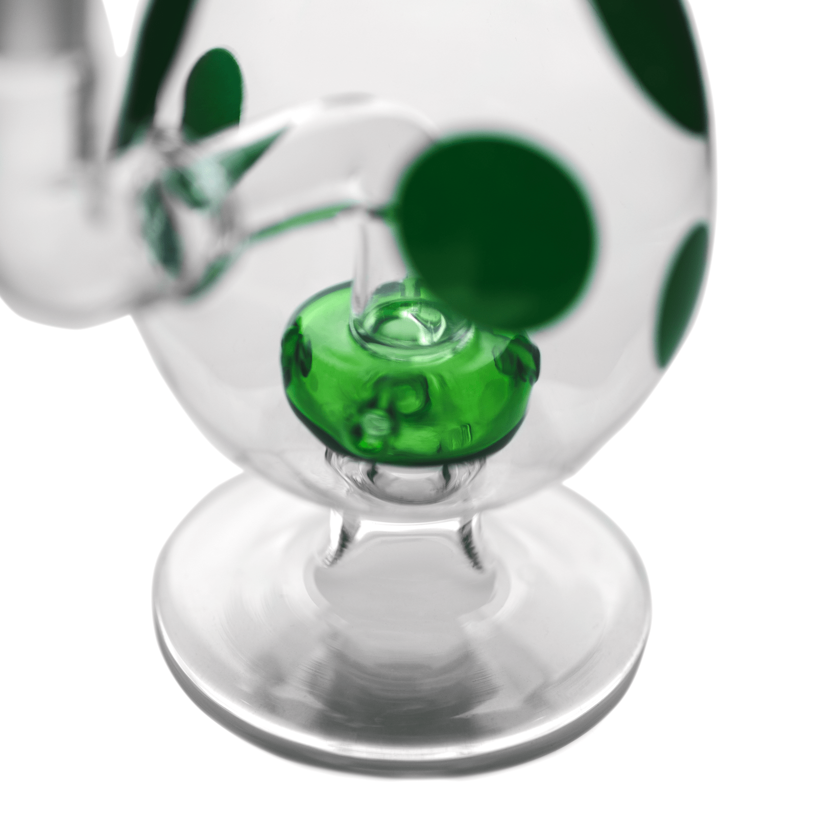 Close-up of the green-spotted glass joint area on the Hemper Spotted Egg XL Bong, shot from above on a white background