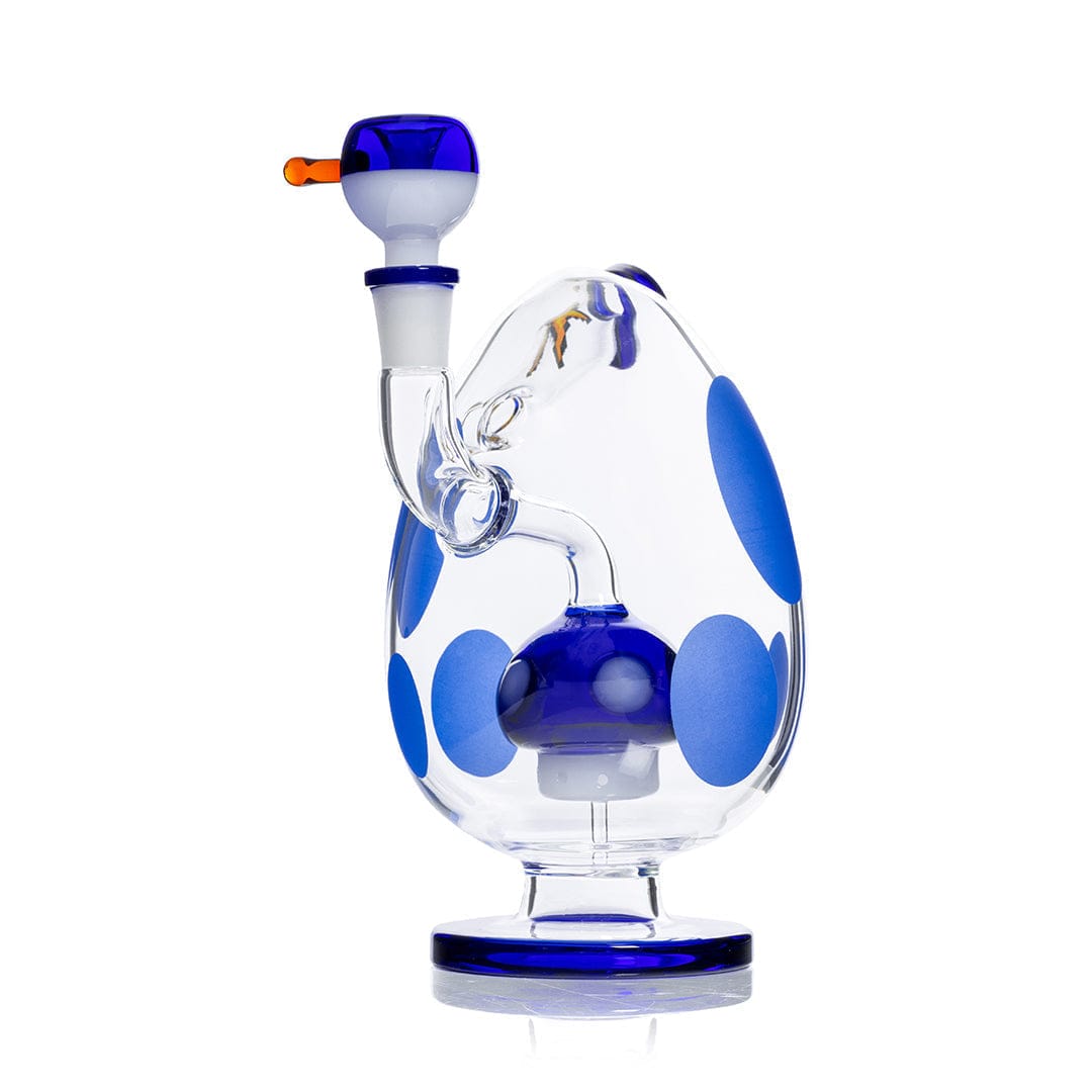 Three-quarter view of the Hemper Spotted Egg XL Bong showing its clear egg-shaped body with large blue spots, internal percolator, and blue-rimmed mouthpiece.