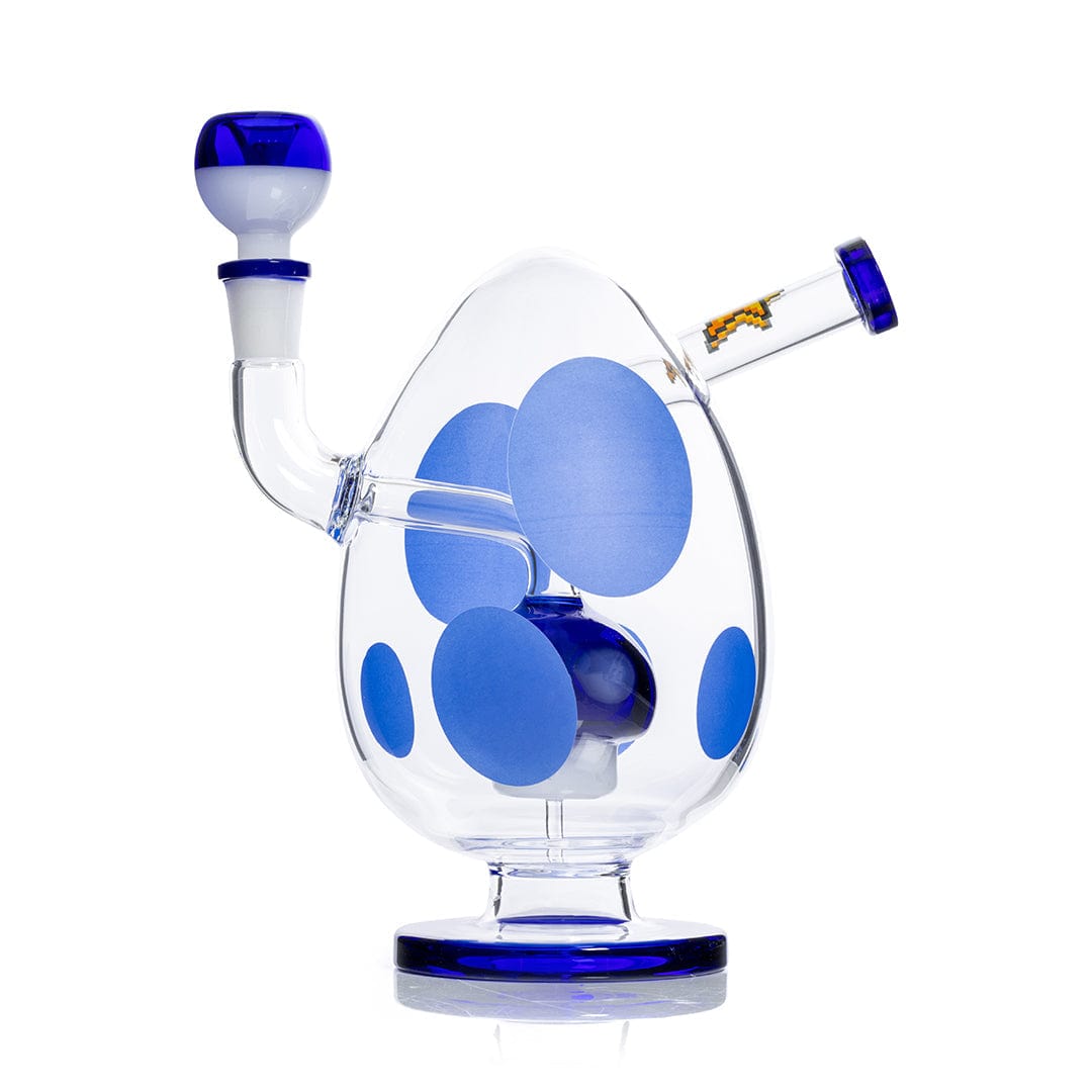Angled front view of the Hemper Spotted Egg XL Bong showing a clear egg-shaped body with large matte blue spots, a matching blue-rimmed mouthpiece and base.