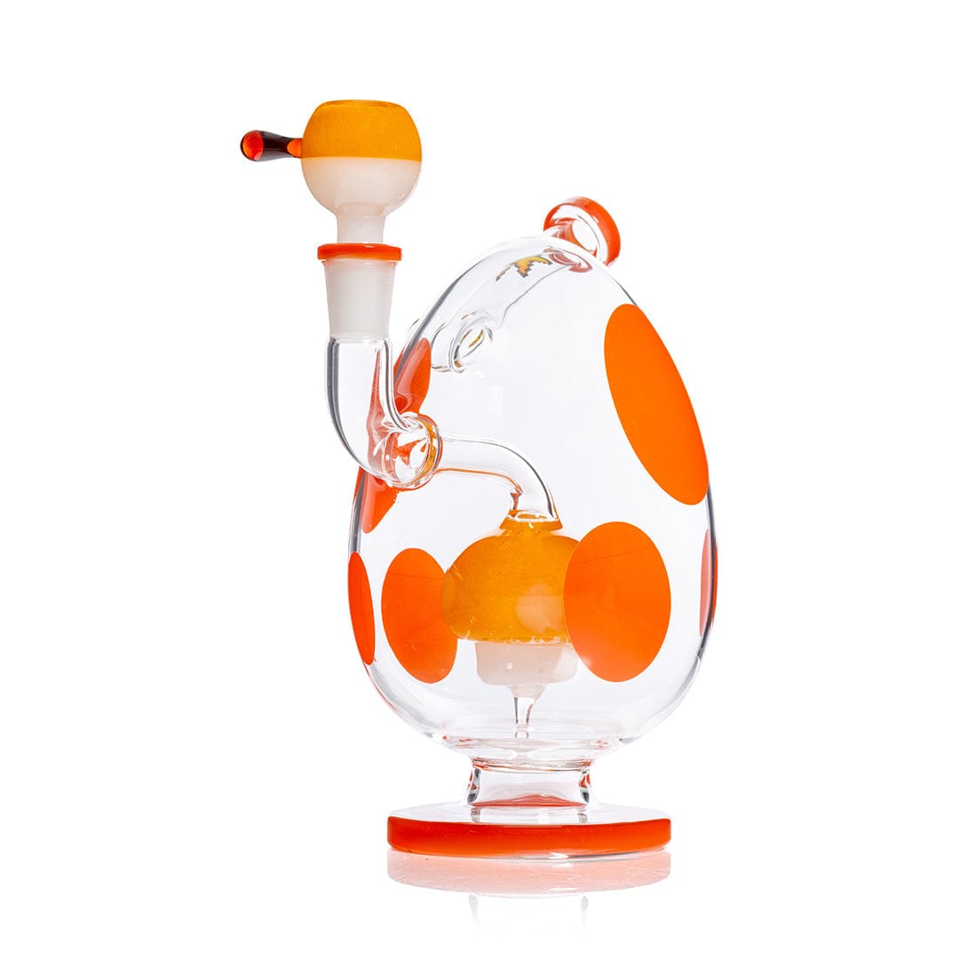 Right-side view of the Hemper Spotted Egg XL Bong, a clear egg-shaped glass piece with bright orange spots and accents on a white background.
