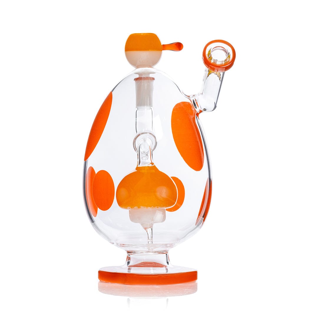 Front view of the Hemper Spotted Egg XL Bong showing a clear egg-shaped body with bright orange spots, mouthpiece, and rounded base.