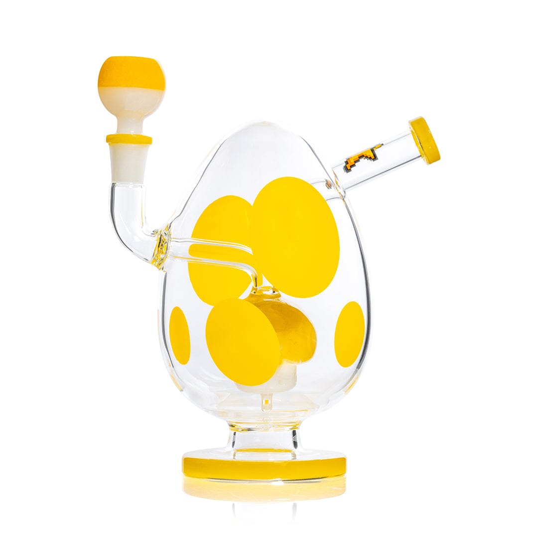Studio-style front view of the Hemper Spotted Egg XL Bong, a clear egg-shaped piece with large yellow polka dots and matching yellow-rimmed mouthpiece and base.