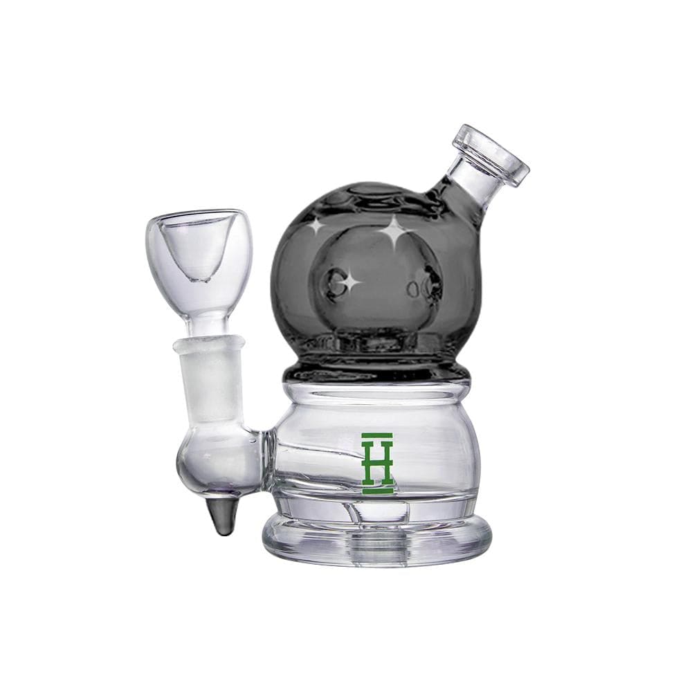 A close-up, angled view of the Hemper Crystal Ball Rig, showcasing its clear glass construction and rounded base.