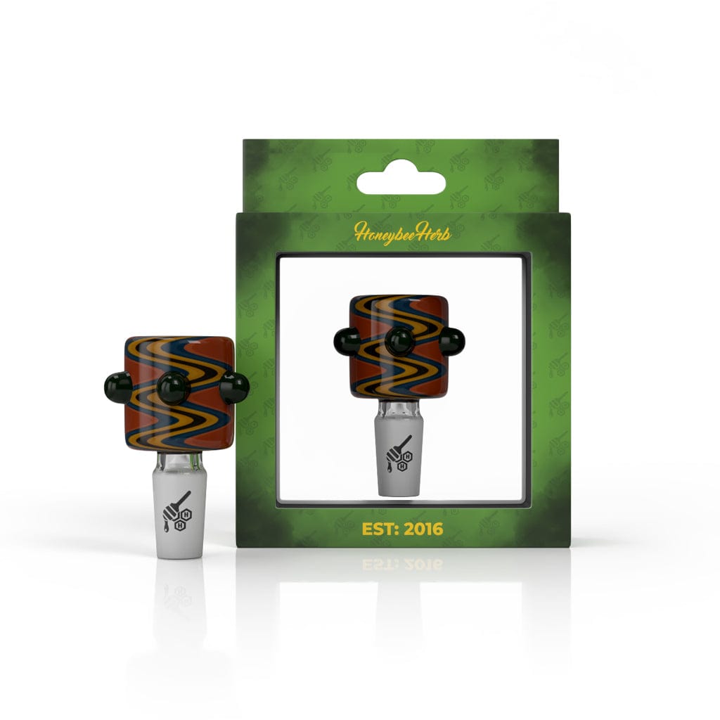 Glass cannabis oil burner pipe in packaging, branded "Honeybee Herbs est. 2016".