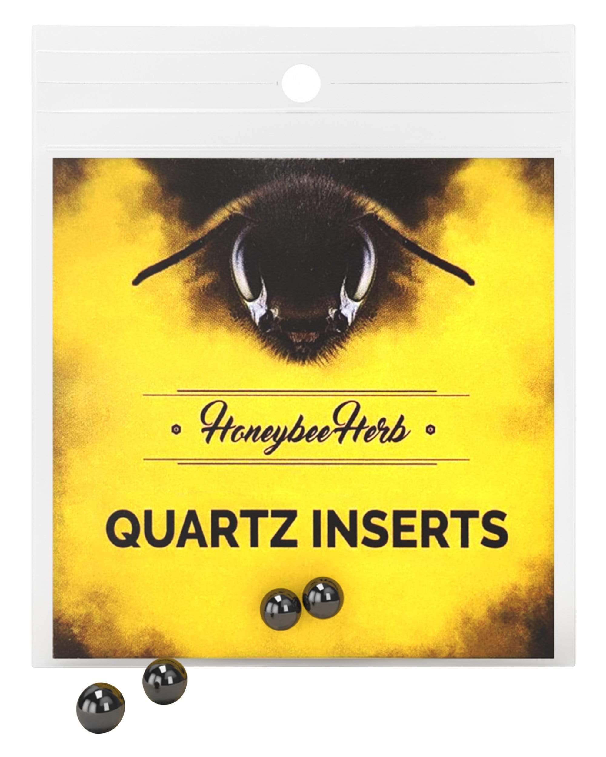 Close-up front view of a white packet labeled Honeybee Herb Honey Pearls showing a yellow bee graphic, bold "QUARTZ INSERTS" text, and three glossy black pearls.