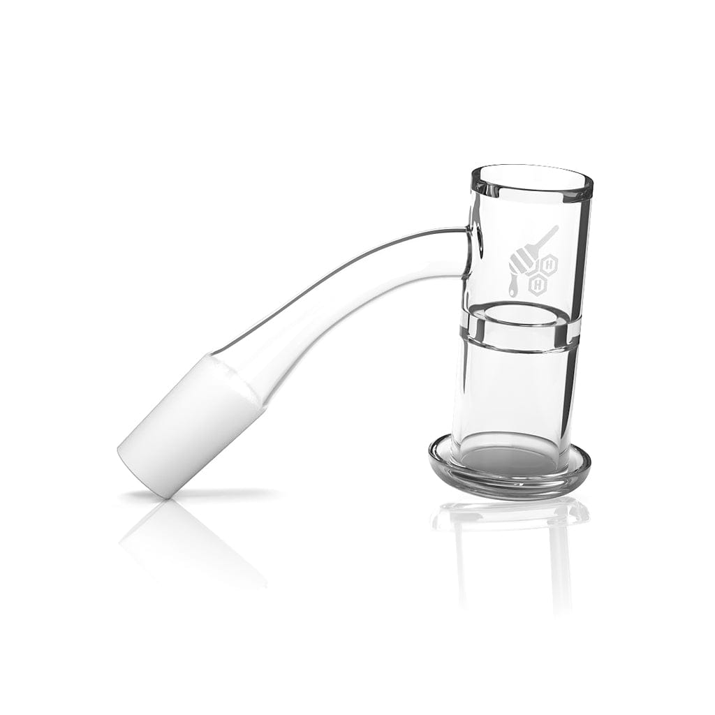 Angled studio view of the clear Honeysuckle Xl Quartz Banger - 45Â° Degree | Yl showing its curved 45-degree neck, bucket chamber, and subtle logo on a white reflective background
