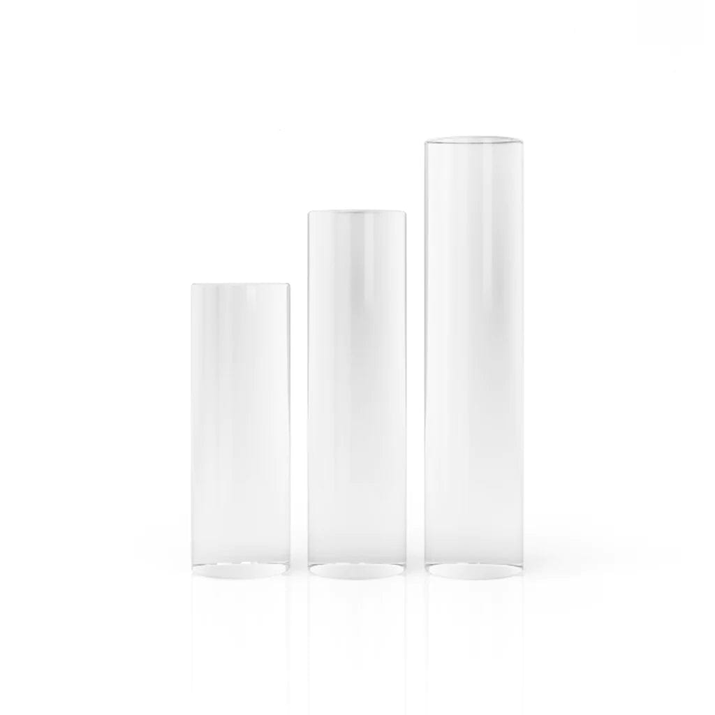 A studio shot of the Quartz Pillars 3 Pack, showing three clear, cylindrical pillars arranged on a white surface.