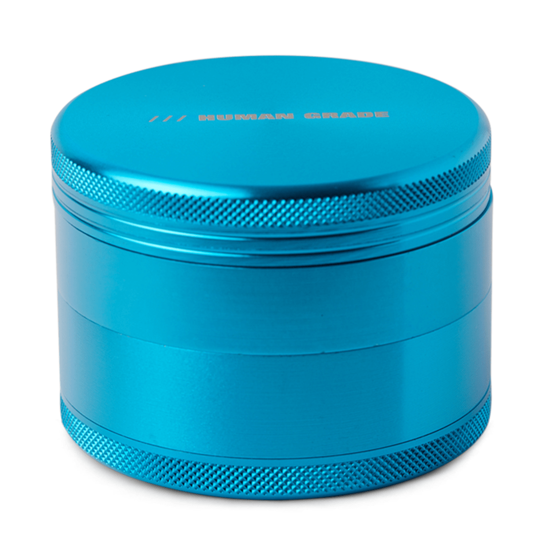 Front view of the Human Grade Grinder 1B (2.5”), a silver metal grinder with a textured exterior and a cylindrical shape.