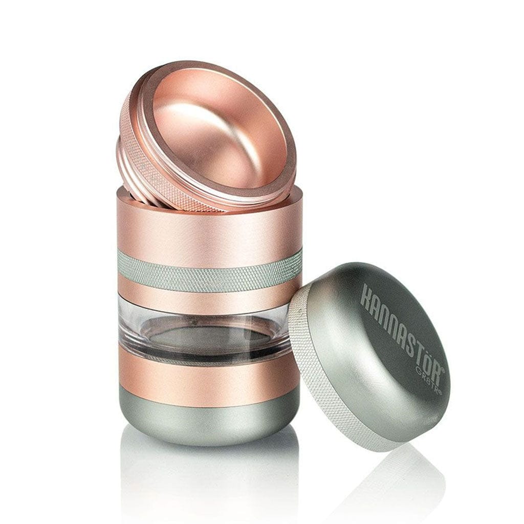 Angled studio shot of the rose-gold and silver Ryot Gr8Tr Jar Body Grinder with its lid removed and side chamber exposed