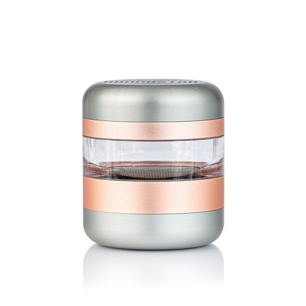 Centered front view of the Ryot Gr8Tr Jar Body Grinder showing its metallic silver and rose-gold bands with a clear middle chamber on a white background