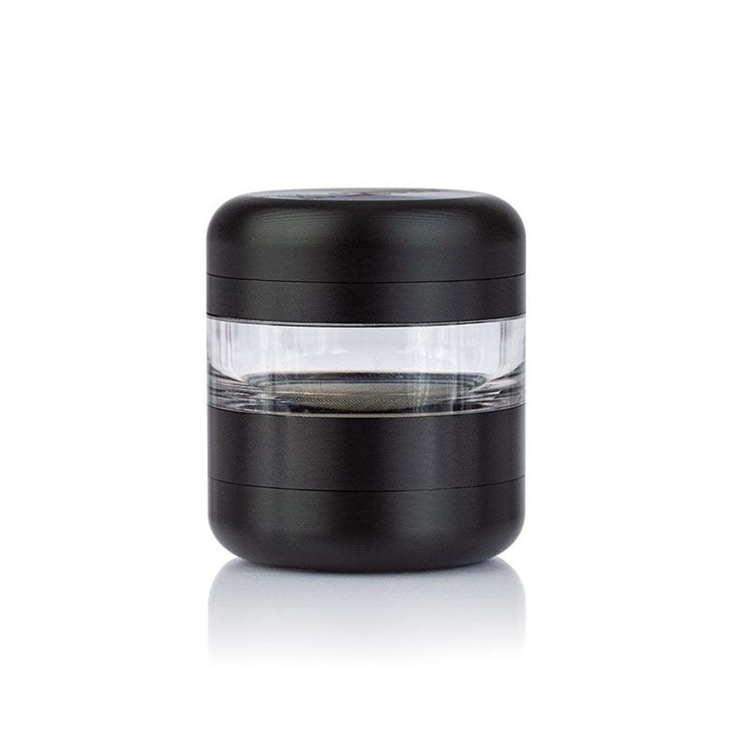 Front-facing shot of a matte black Ryot Gr8Tr Jar Body Grinder with a clear middle chamber and soft studio reflection.