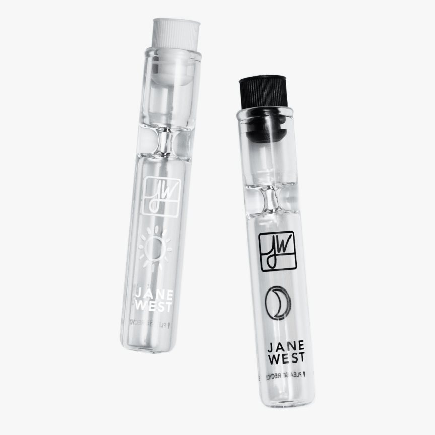 Front view of the Day & Night Travel Pipe Set, a clear glass pipe with branded lettering, against a plain white background.