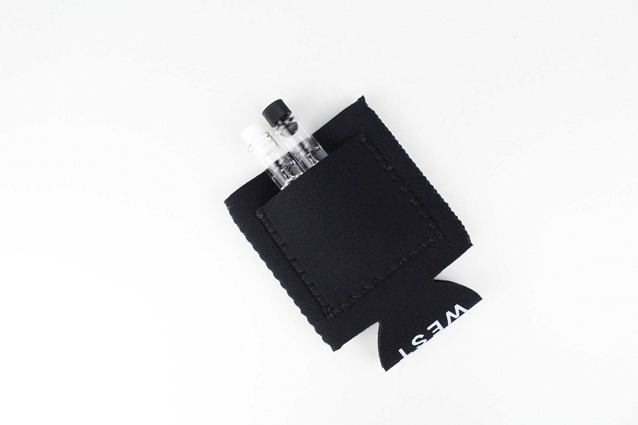 Angled close-up of a black Jane West Koozie with Custom Pocket holding two small clear cartridges against a white background