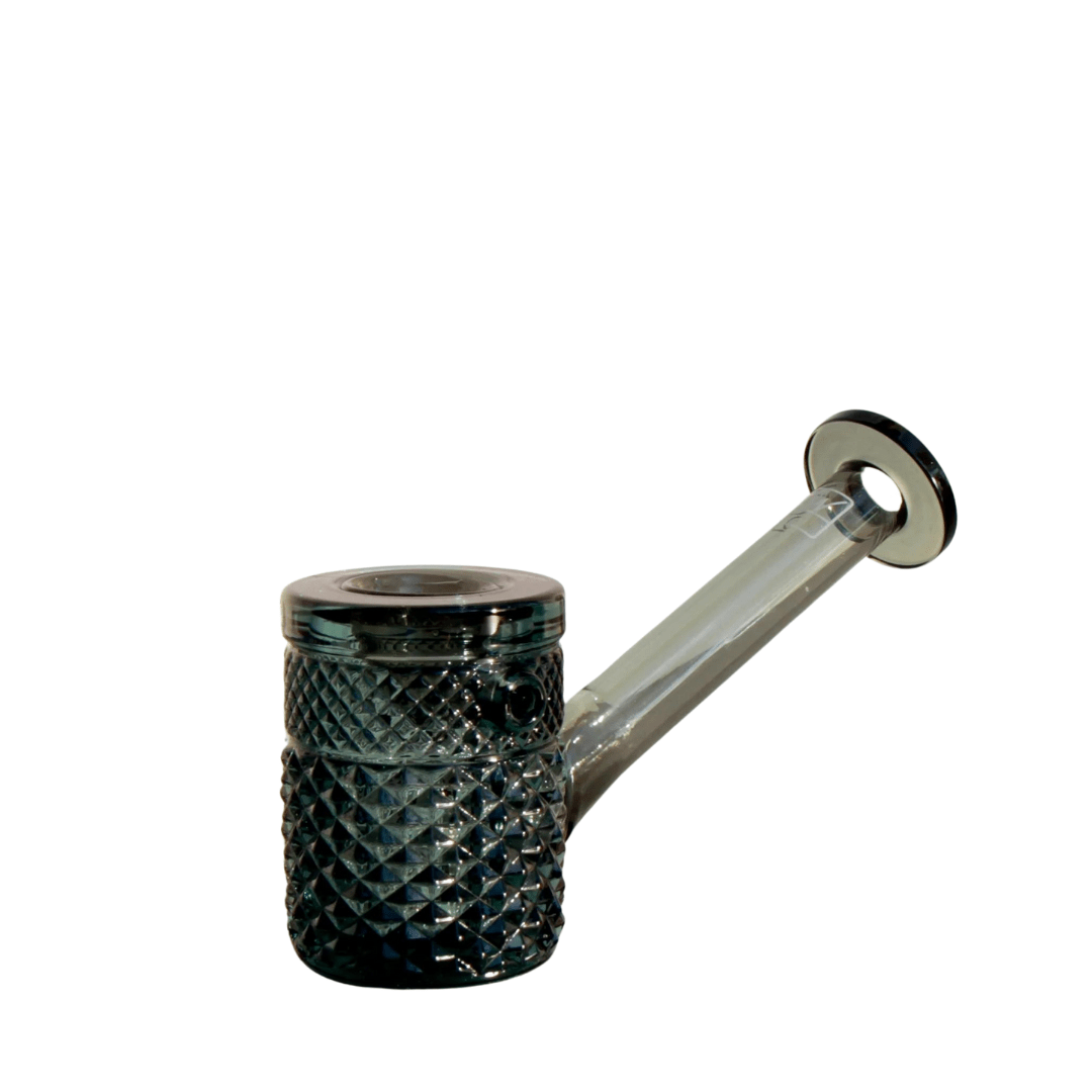 A close-up, angled view of the Jane West Twenties Collection Hand Pipe, showcasing its textured, dark glass construction.