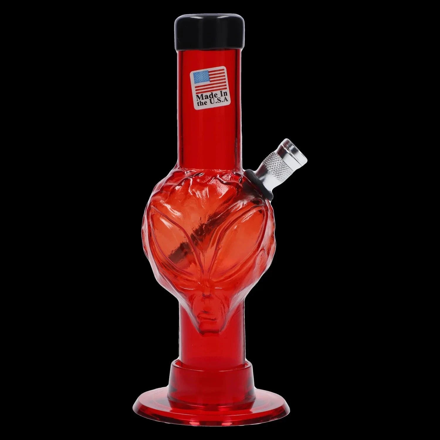 Close-up front view of the JM Plastics Mini Alien Base Acrylic Bong - 6 in. in translucent red with an alien-face body and a silver angled bowl against a black backdrop