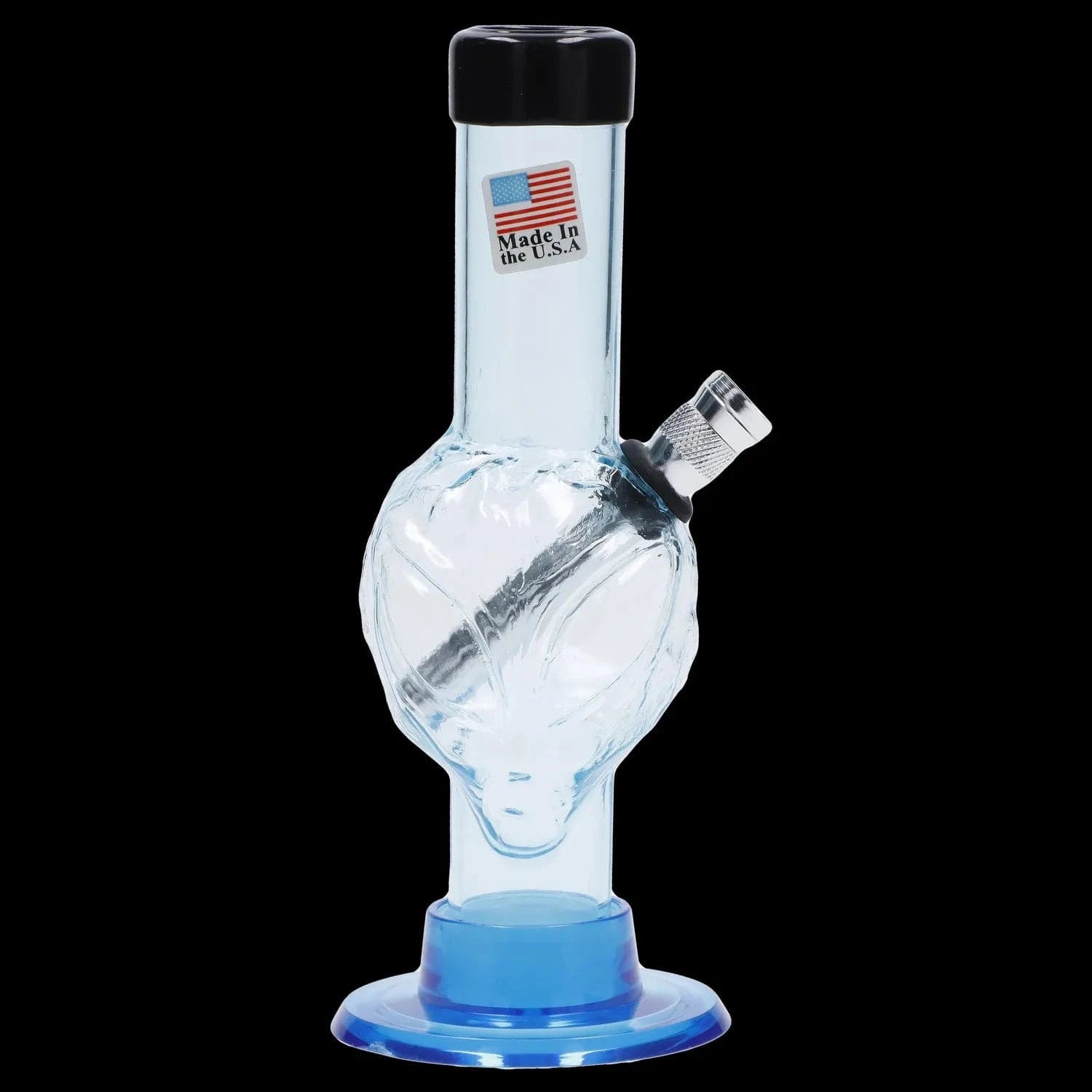 Close-up front view of the JM Plastics Mini Alien Base Acrylic Bong - 6 in. showing a light-greenish clear alien-shaped chamber, metal downstem and blue plastic base against a black background