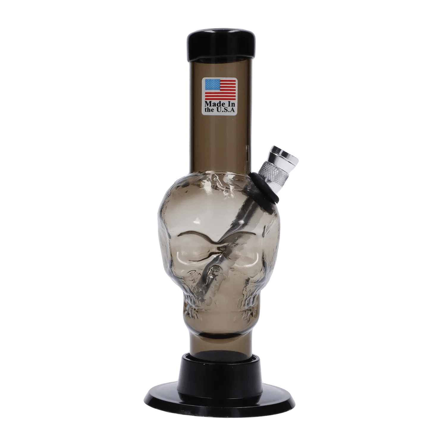 Front view of the JM Plastics Mini Skull Base Acrylic Bong - 6 in. in smoke tint, showing a skull-shaped chamber, angled metal bowl, and black base against a white background