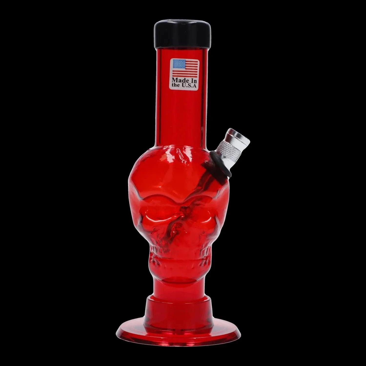 Front view of the JM Plastics Mini Skull Base Acrylic Bong - 6 in. in translucent orange-red against a black background, showing the skull-shaped midsection and angled metal bowl.