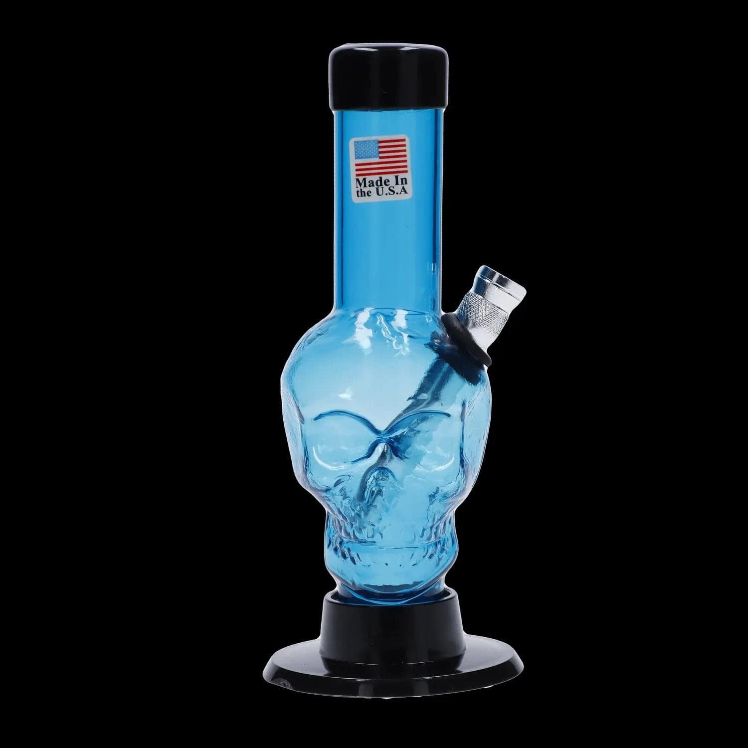 Centered front view of the JM Plastics Mini Skull Base Acrylic Bong - 6 in. in clear blue with a skull-shaped body, angled metal bowl, and black base against a black background