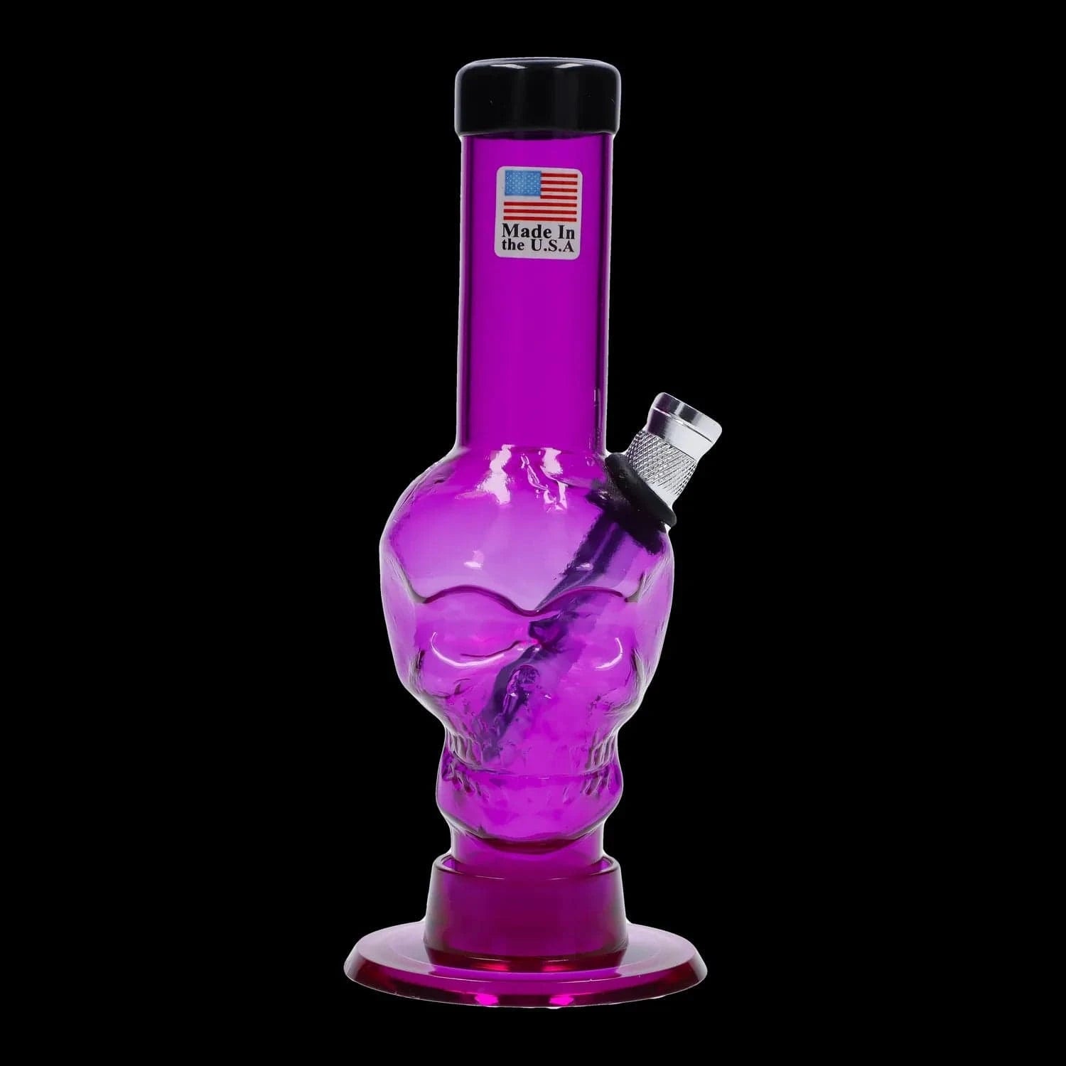 Close-up front view of the JM Plastics Mini Skull Base Acrylic Bong - 6 in. in translucent red showing the skull-shaped chamber, angled metal bowl, and black background
