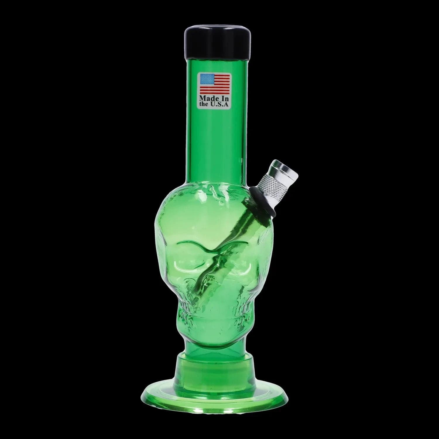 Front view close-up of the green JM Plastics Mini Skull Base Acrylic Bong - 6 in. showing a skull-shaped chamber and angled metal bowl against a black background