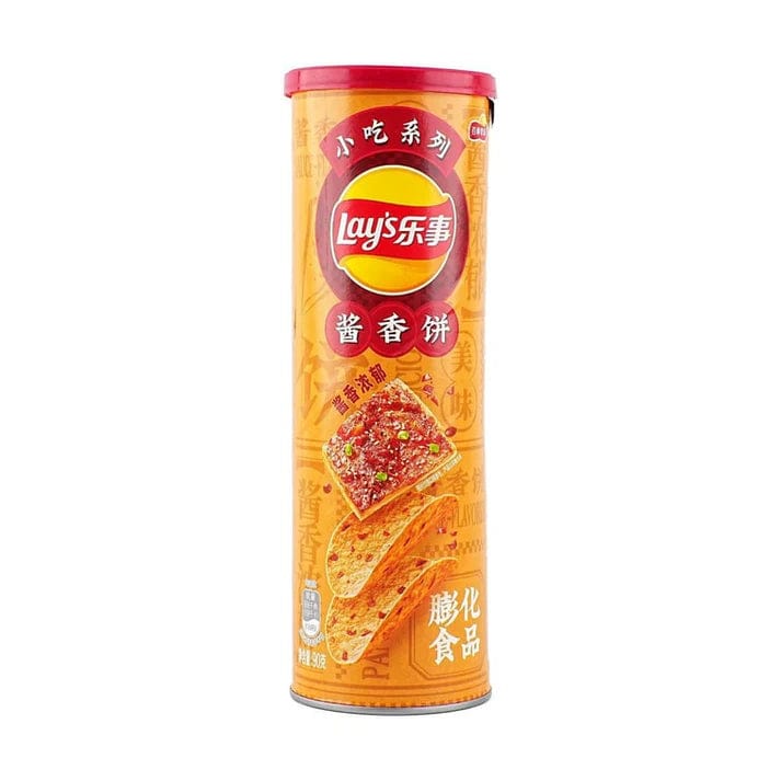 Front view of Lay's Chips - Stax Pancake Sauce packaging with a brightly colored label and text in a foreign language.