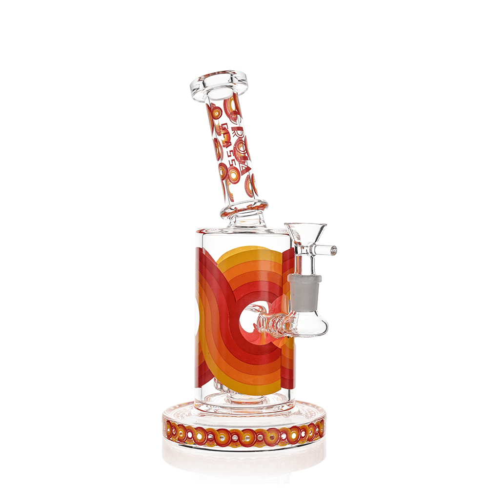 Angled studio shot of the Croia Glass Retro Scientific Bong with Matrix Perc | Croia Glass showing a clear glass bong with orange and red concentric ring graphics and a tilted neck.