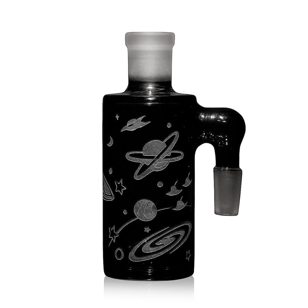 Front-facing shot of the Milkyway Space Odyssey Wet Ash Catcher in black glass with engraved planets, rings, stars and a side joint.