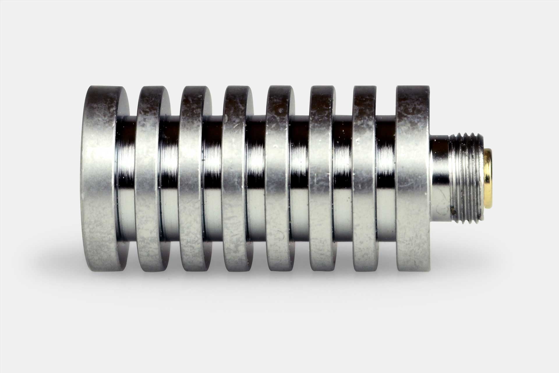 Close-up side view of the metallic Nectar Collector E-Tip Extender & Heat Sink showing stacked cooling fins and a threaded brass end against a white background