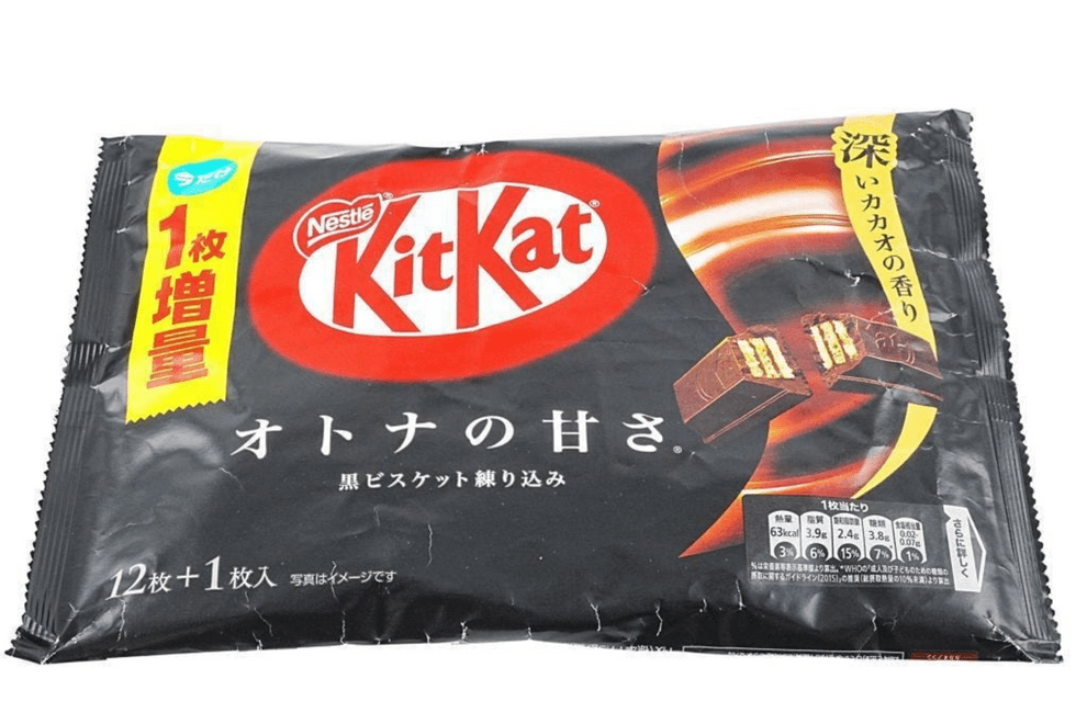 Close-up of a Japanese KitKat - Dark Chocolate wrapper with Japanese text, angled slightly to the right.