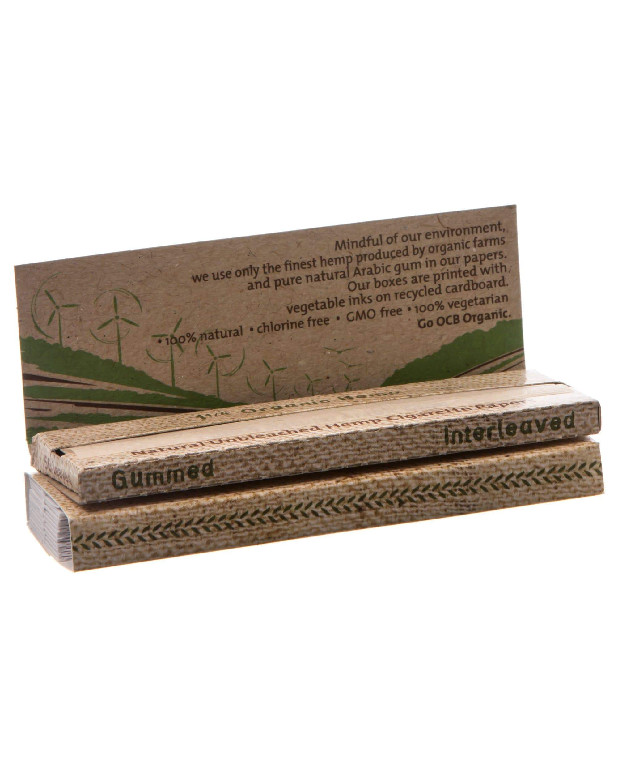Close-up of Organic Hemp Rolling Papers stacked, showcasing the simple branding on their cardboard packaging.