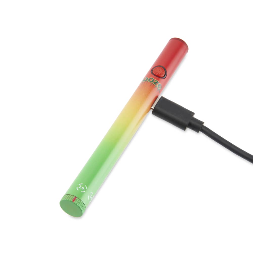 A close-up, angled view of the Twist Slim Pen 2.0 510 Thread Vaporizer Battery with a charging cable connected to the bottom.