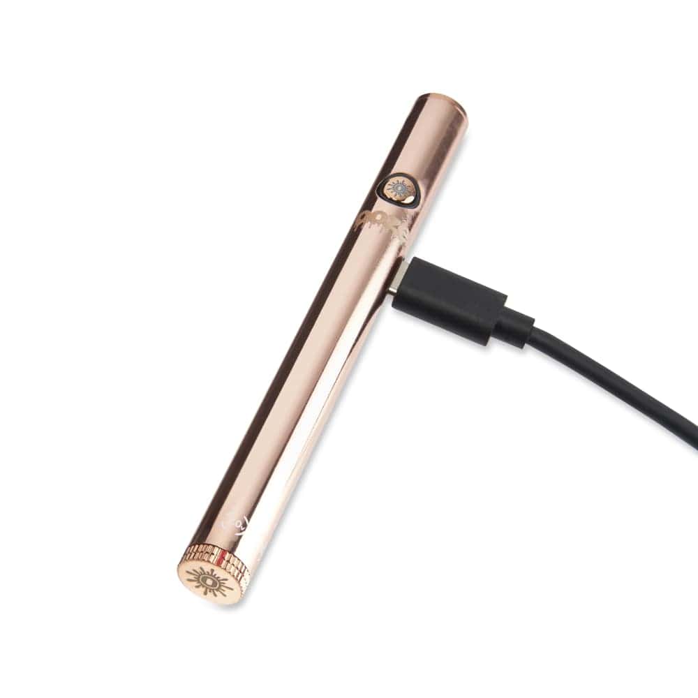 A close-up, angled view of the Twist Slim Pen 2.0 510 Thread Vaporizer Battery with a black charging cable connected.