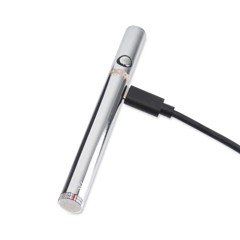 A close-up, angled view of the Twist Slim Pen 2.0 510 Thread Vaporizer Battery with a USB cable connected to its base.
