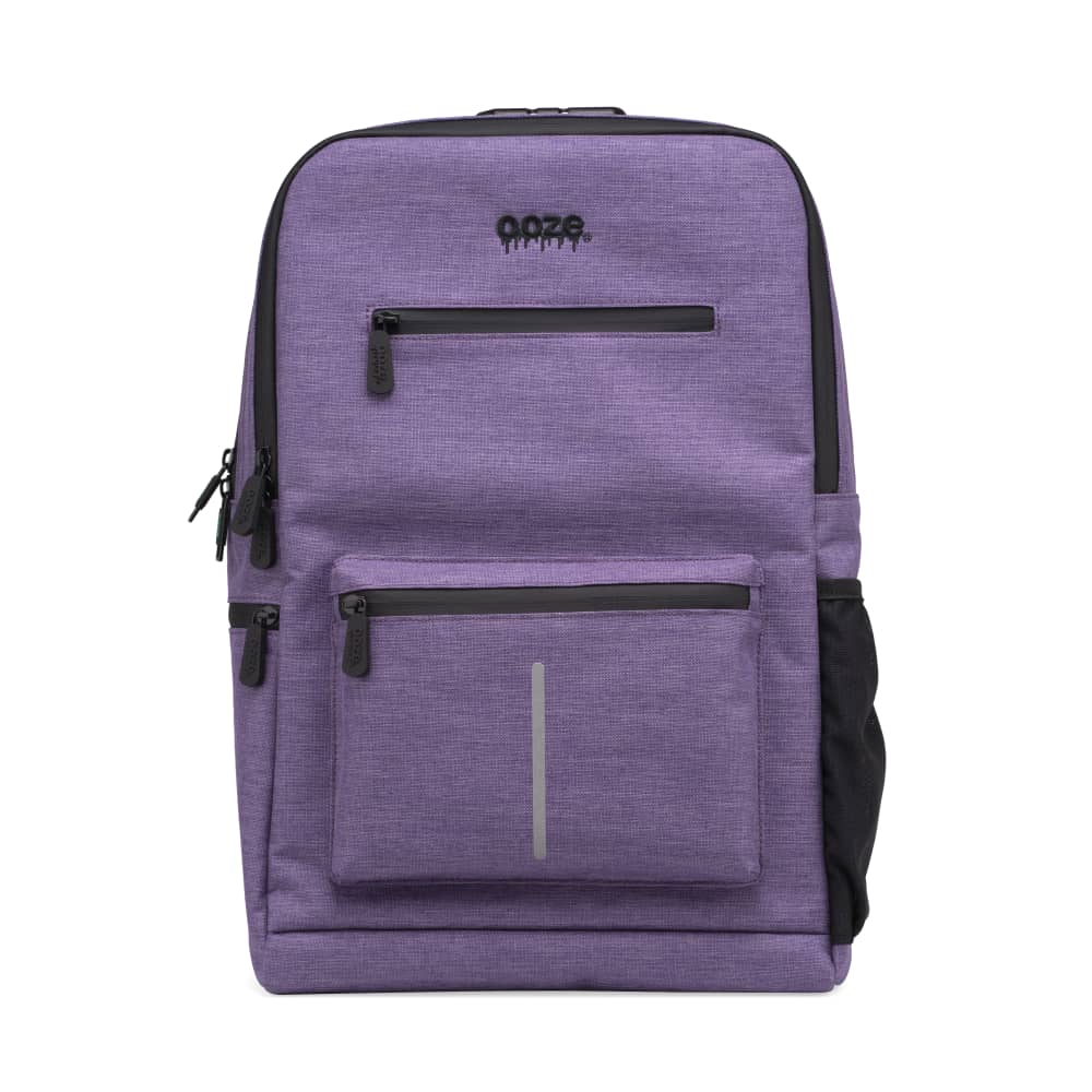 Front view of the Ooze Traveler Smell Proof Backpack, a purple bag with multiple zippers and a branded tag.