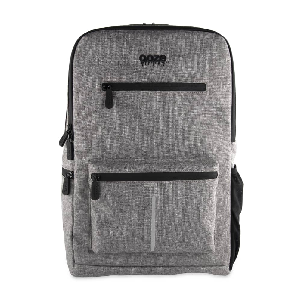 Front view of the Ooze Traveler Smell Proof Backpack, a gray bag with a zippered front pocket.