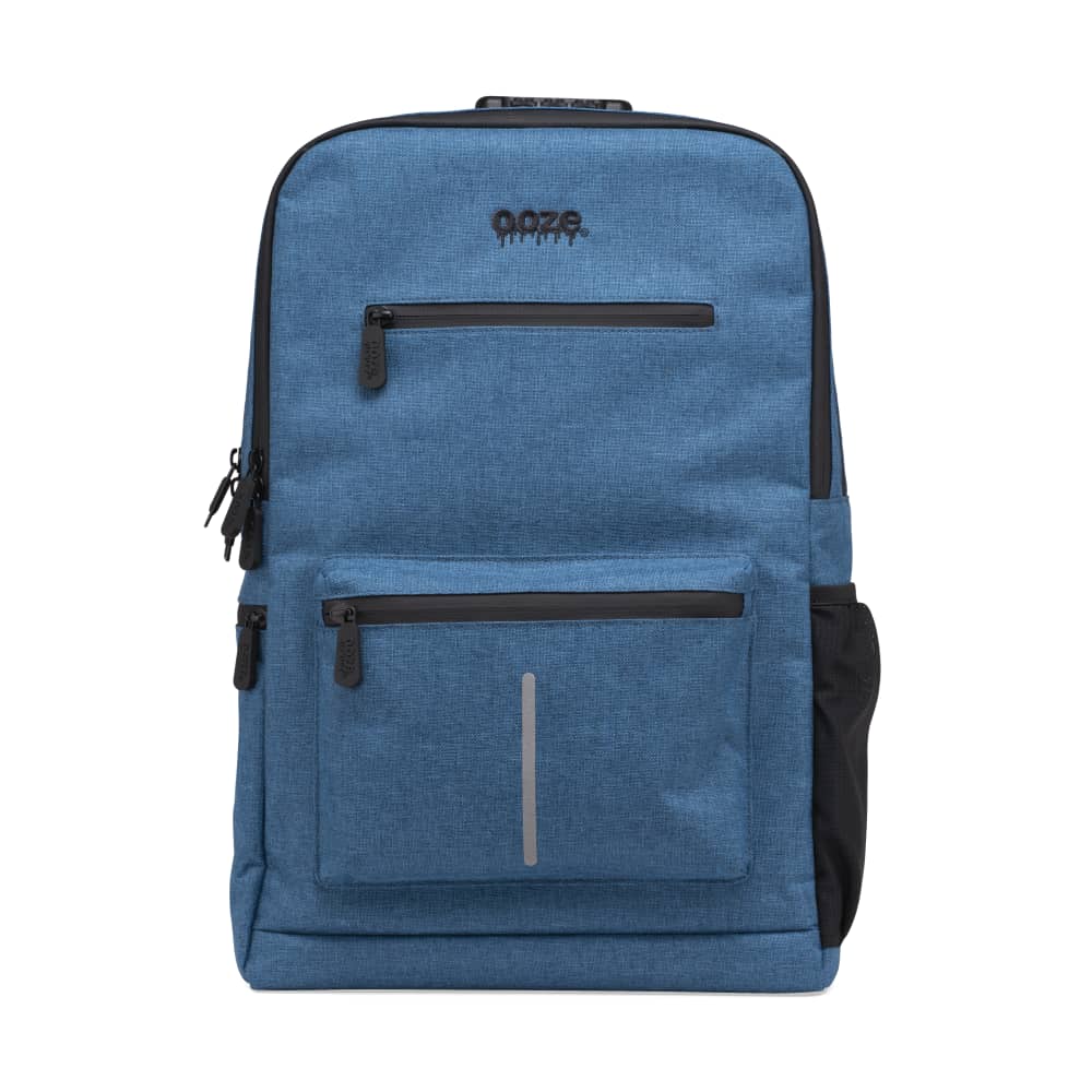 Front view of the Ooze Traveler Smell Proof Backpack, a dark blue bag with multiple zipped compartments and a textured fabric.