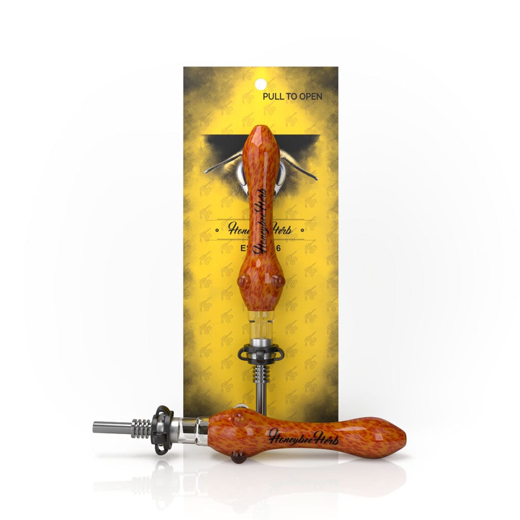Front view of the Speckled Glass Nectar Collector on its yellow retail card, shown upright and again lying forward to reveal its orange-speckled glass handle and metal tip.