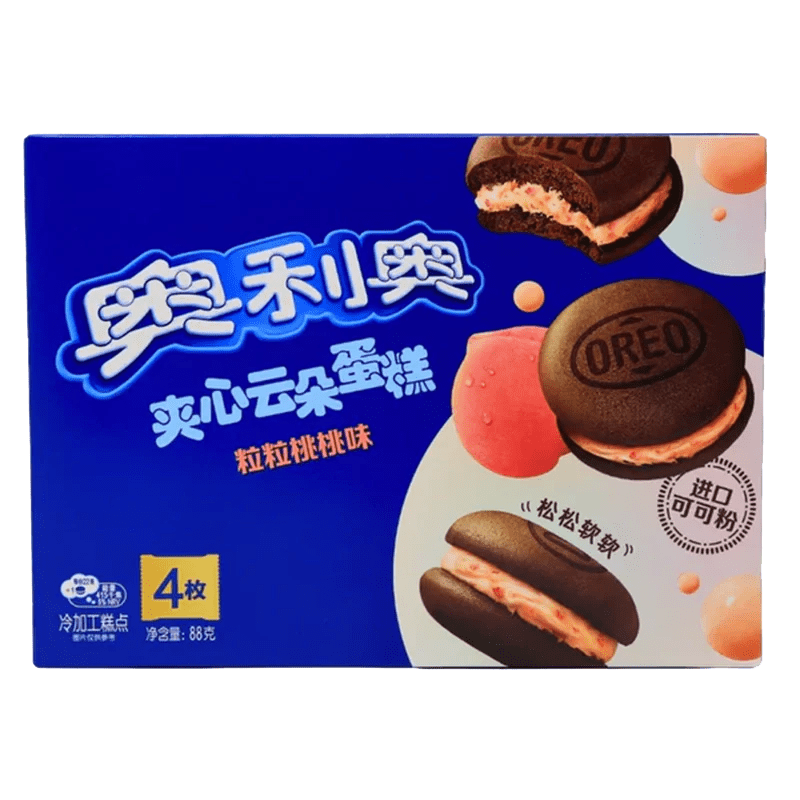 A close-up of Oreo Cakesters - Peach, showing a stack of peach-colored cakes with the Oreo logo visible on top.