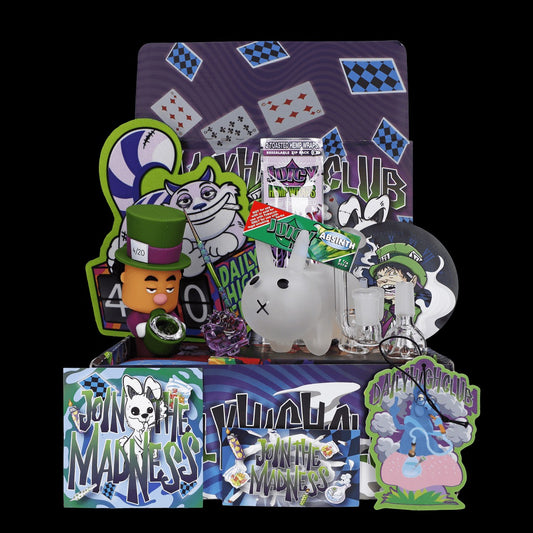 A high-angle view of the “420 Bunny” Smoking Box with colorful cartoon graphics and wrapping paper surrounding a collection of smoking accessories.