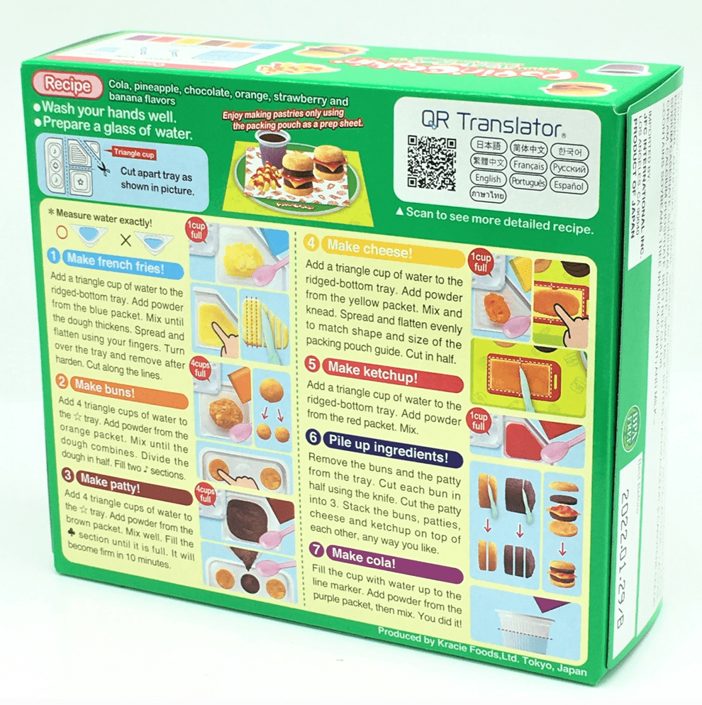 A top-down view of the “DIY Candy Making Kit - The Hamburger Box” instruction sheet with colorful illustrations and text in multiple languages.