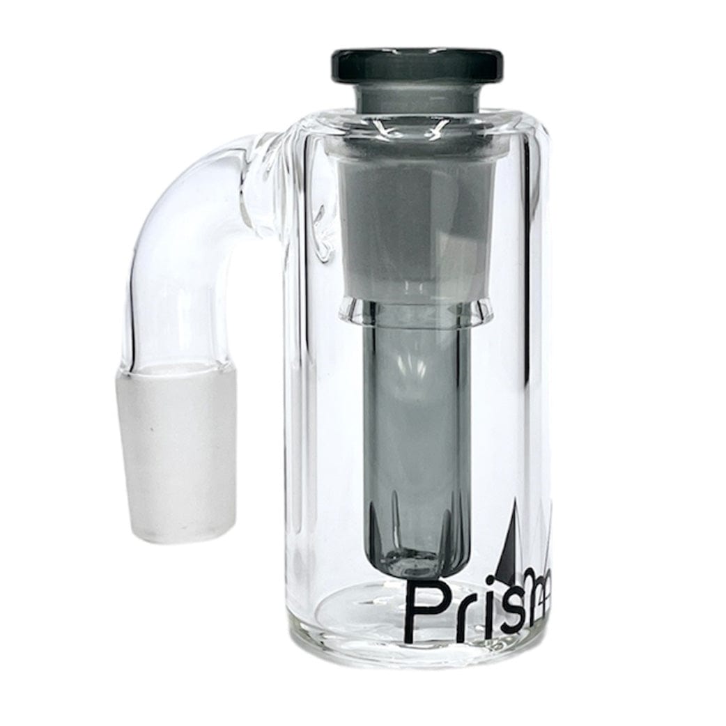 Front three-quarter view of a clear glass Prism Honeycomb Base Ash Catcher showing its cylindrical outer chamber, internal honeycomb-style downstem, angled joint arm to the left, and partial logo at the base.