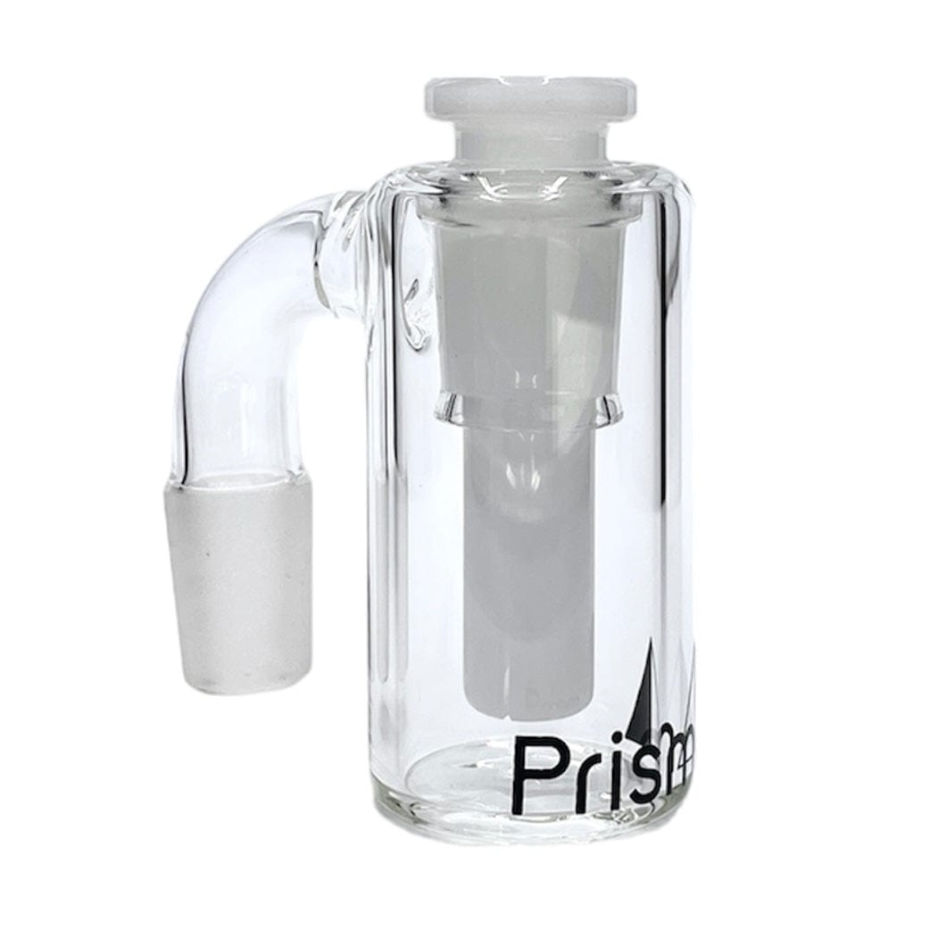 Front three-quarter view of a clear glass Prism Honeycomb Base Ash Catcher showing its upright cylindrical chamber, angled side joint, internal downstem and black partial logo on a white background