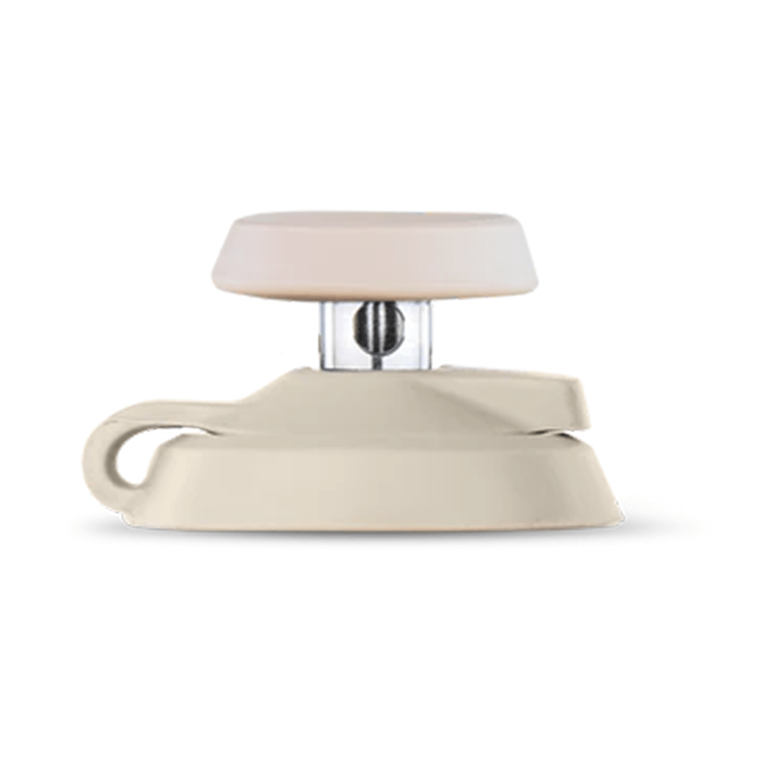 Side view of a beige Puffco Proxy Carb Caps piece showing its low-profile dome, clear central post, and looped base against a white background.