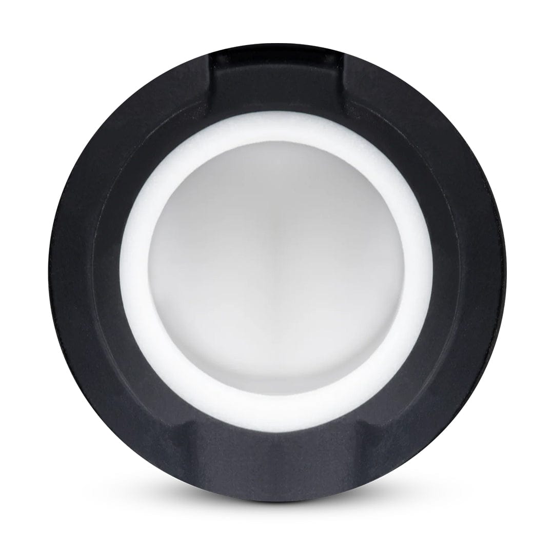Top-down view of the circular New Peak 3D Chambers showing a white inner ring and matte black outer rim against a white background.