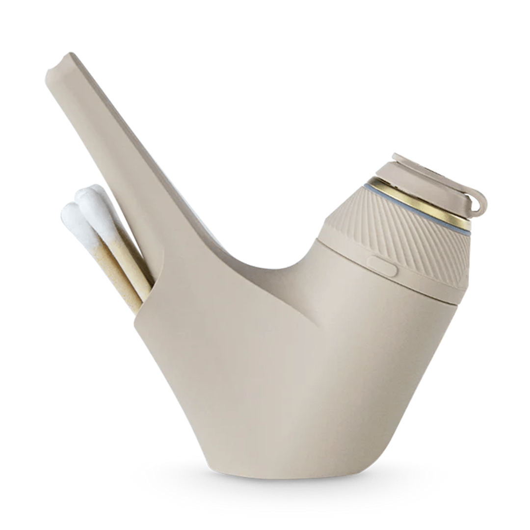 Side profile of a matte purple Puffco Proxy Travel Pipe showing its angled mouthpiece, textured cap with gold trim, and a built-in match storage slot.