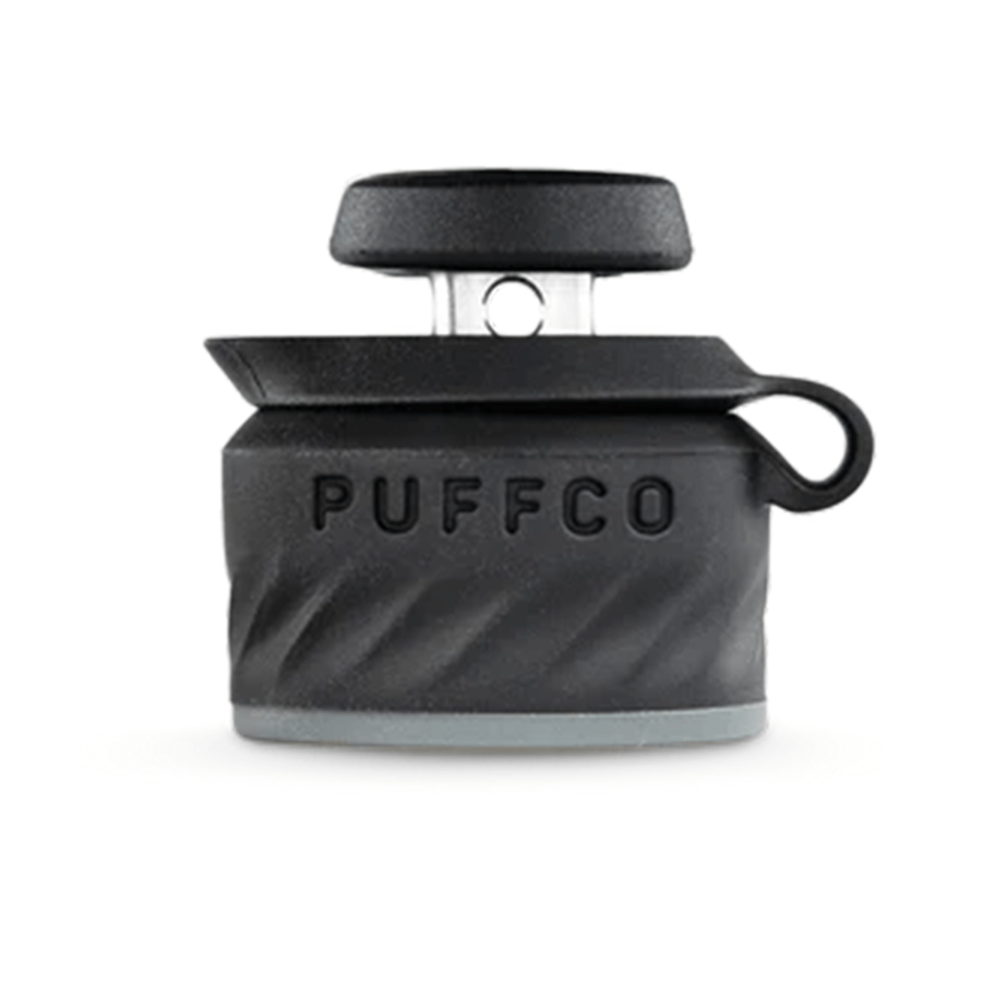Centered front view of the Puffco Peak Pro Joystick Cap in dark gray with embossed PUFFCO text and a looped side tab.