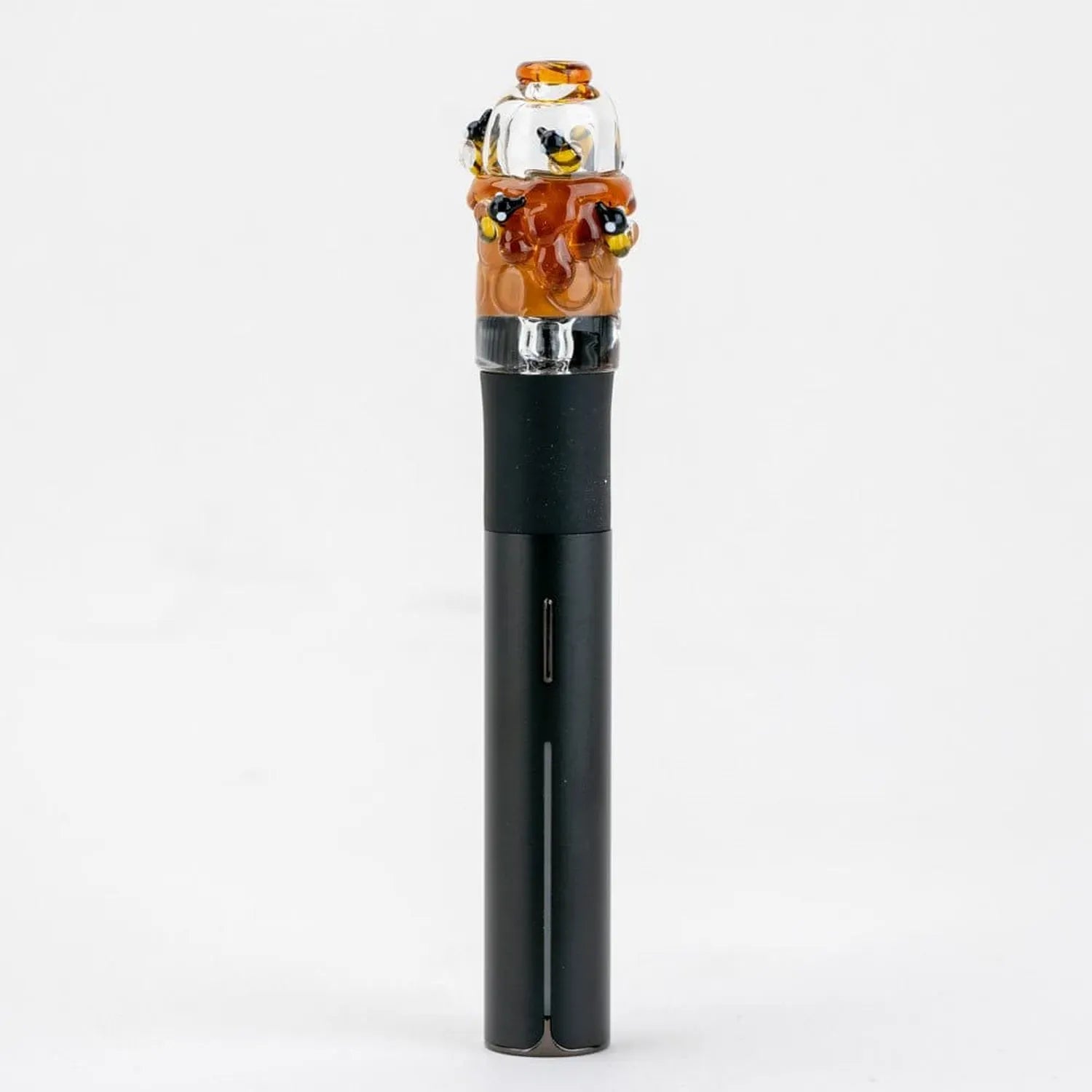 Centered close-up of the Empire Glassworks Puffco Pivot Glass Mouthpiece - Save the Bees showing a clear glass top with amber honey drip detailing and tiny bee accents on a black Pivot stem.