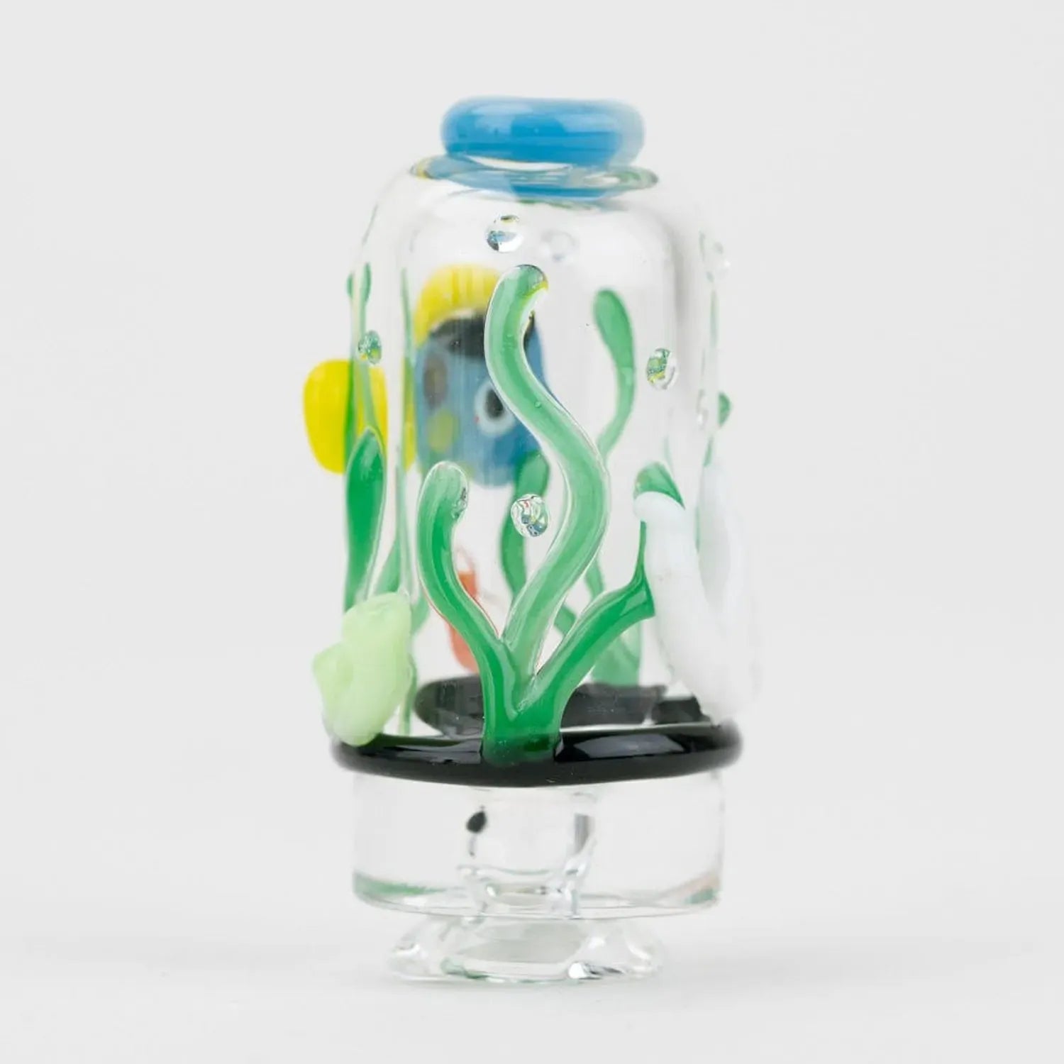 Close-up front view of the Empire Glassworks Puffco Pivot Glass Mouthpiece - Under the Sea showing green glass seaweed, a blue top and small air bubbles inside.