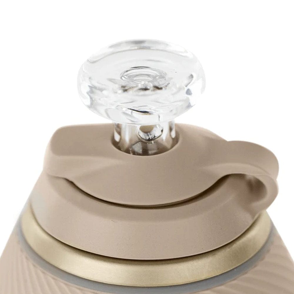 A close-up, angled view of the Proxy "Desert" Travel Pack, showing its textured, tan-colored surface.